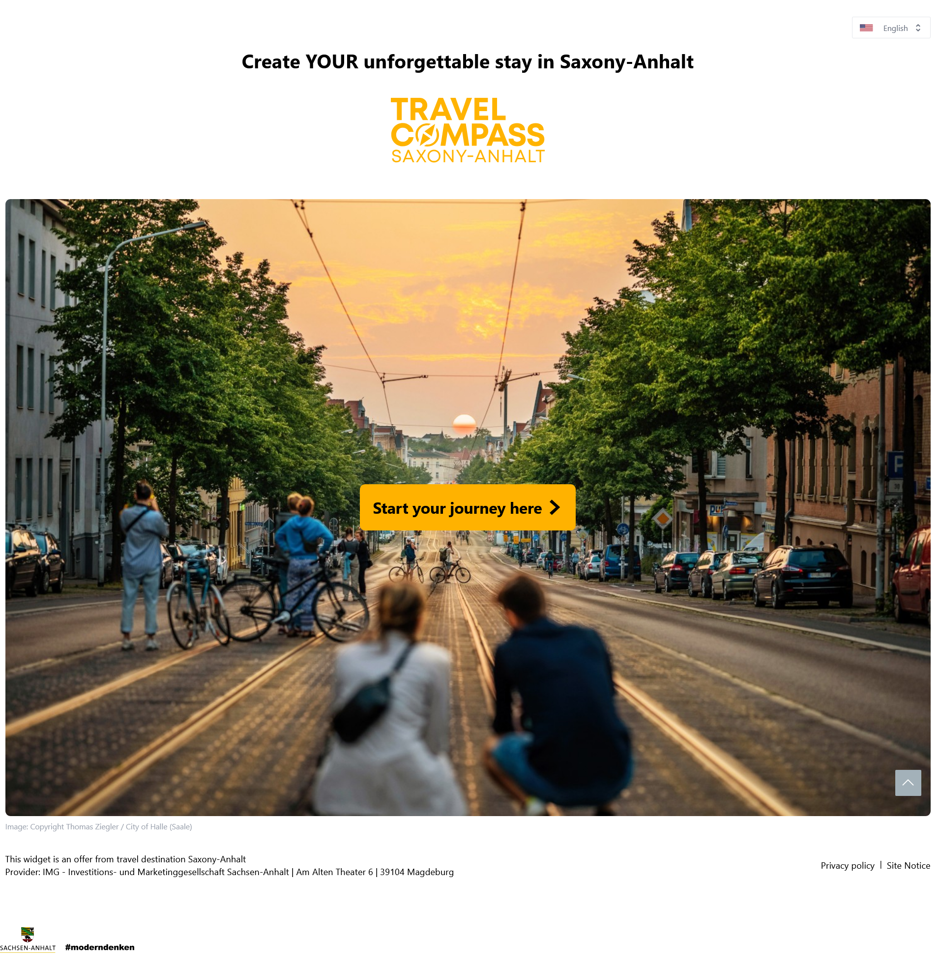 Screenshot showing the Travel Compass. A photo of a street at dusk, overlaid with a button inscribed with Start your journey here.